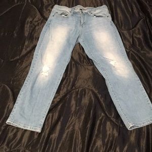Light denim jeans with detail rips